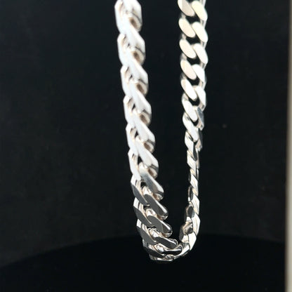 Silver curb chain weighing 109.9g, unbranded jewelry chain with a sleek, classic design, shown laid flat in the image.