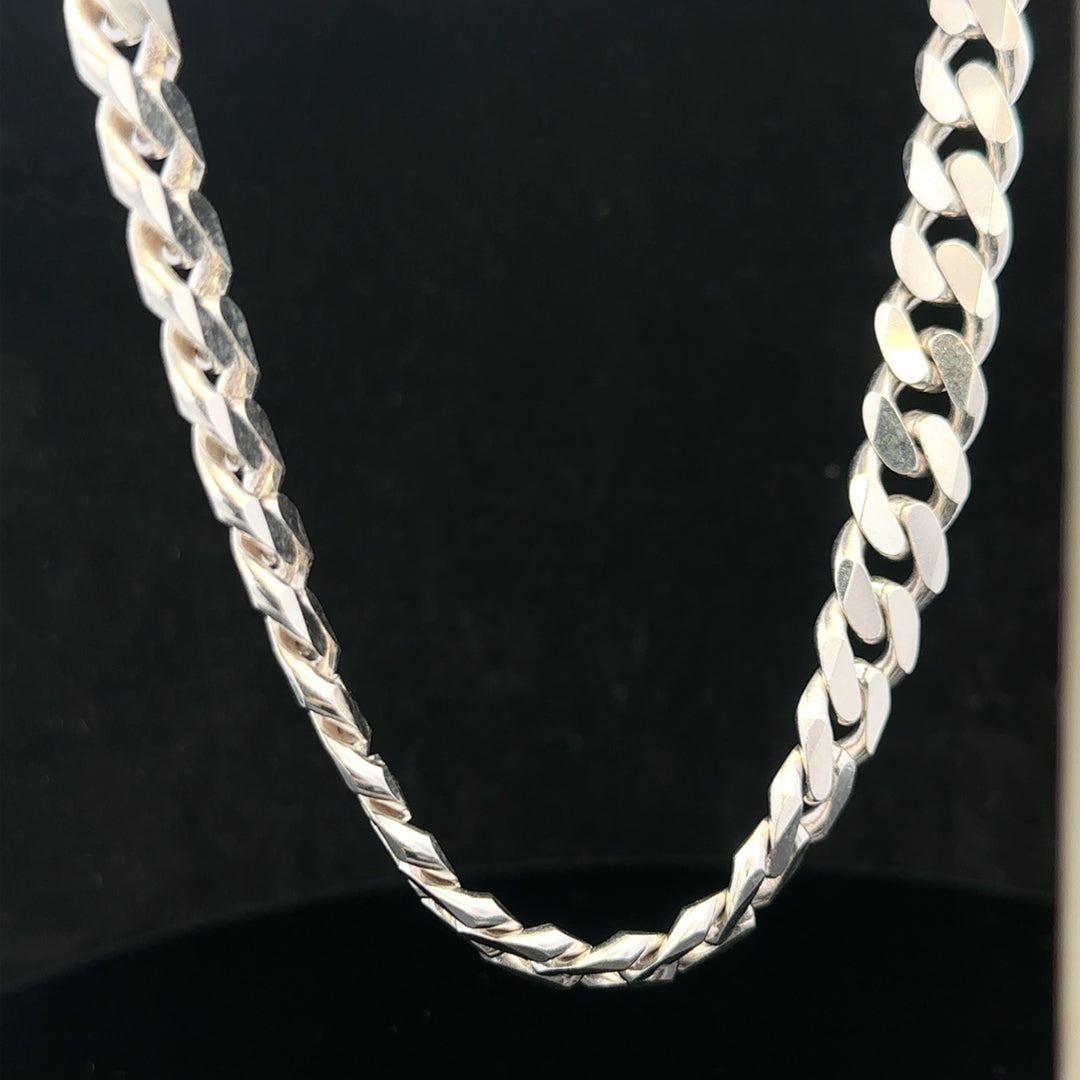 Silver curb chain, unbranded, 109.9g, with closely linked oval-shaped links, displayed on a plain background.