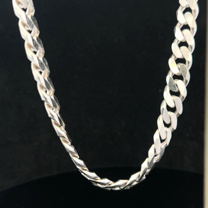 Silver curb chain, unbranded, 109.9g, with closely linked oval-shaped links, displayed on a plain background.