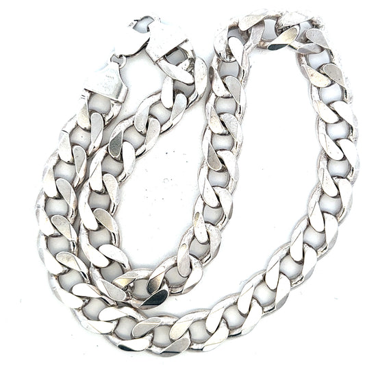 Unbranded silver curb chain weighing 134.5g, showcasing its smooth, interconnected links in a close-up view.
