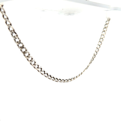 Silver curb chain weighing 16.2g with a classic design, shown in a close-up image highlighting its links and polished finish.