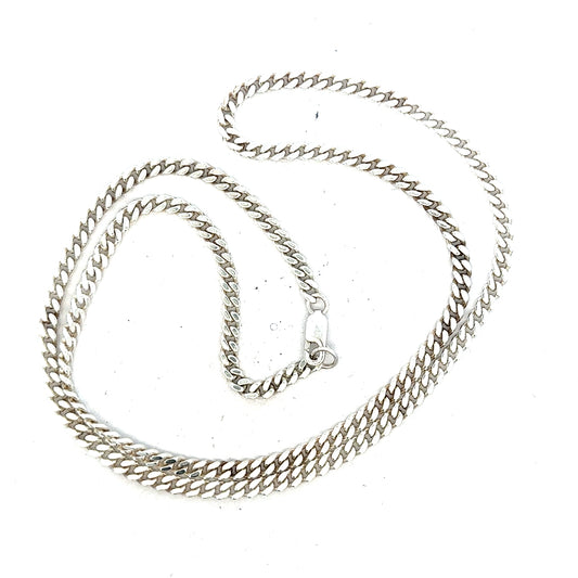 Silver curb chain weighing 24.8g, featuring a classic link design, crafted for a stylish unbranded jewelry piece.
