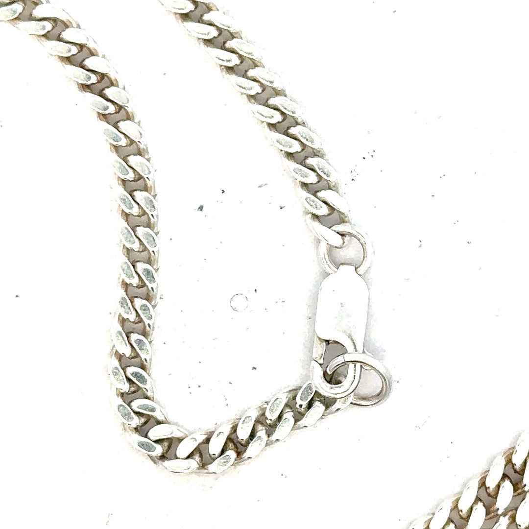Silver curb chain weighing 24.8g, unbranded jewelry chain with a classic curb link design.