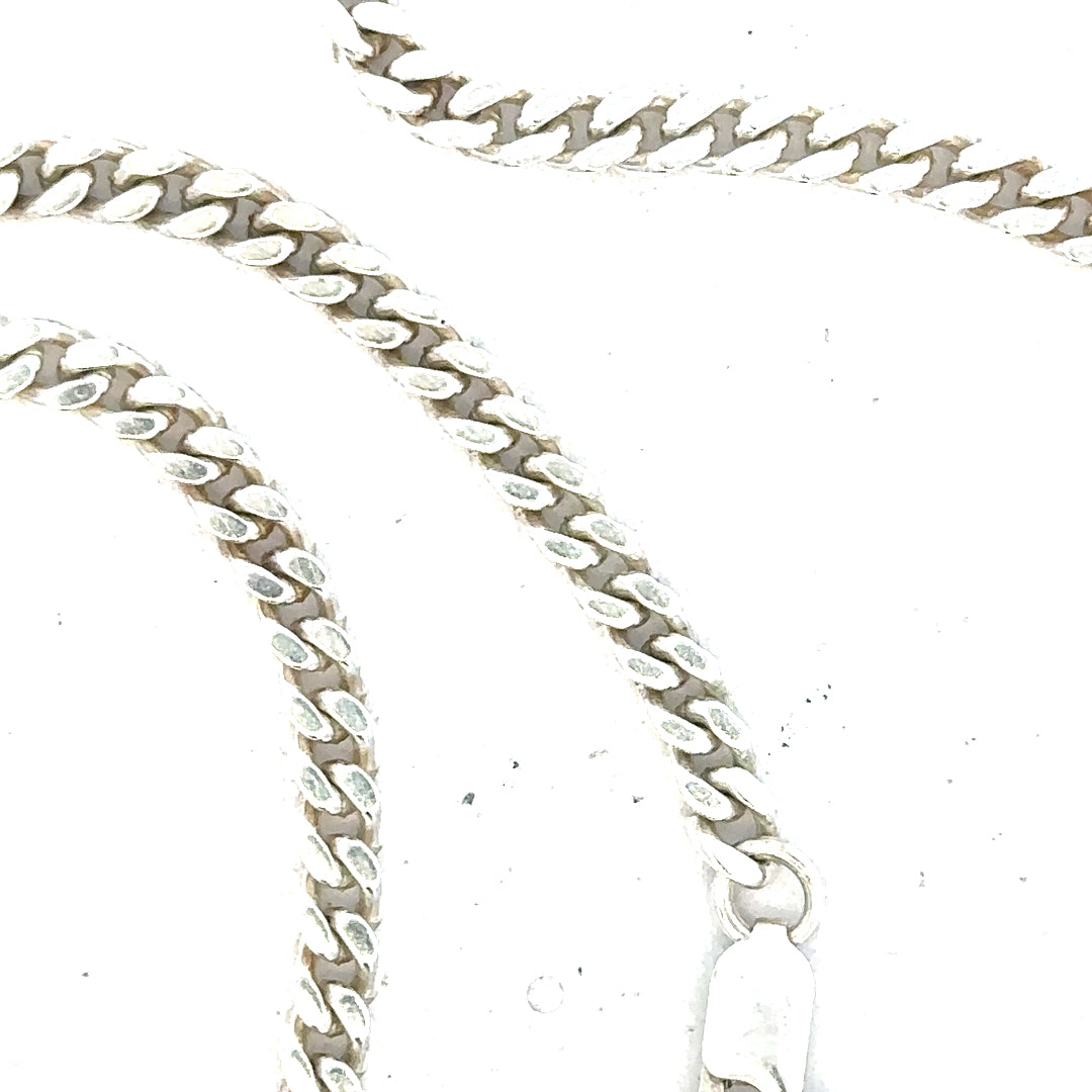 Silver curb chain weighing 24.8g, unbranded jewelry chain with a classic interlinked design, shown in the image.