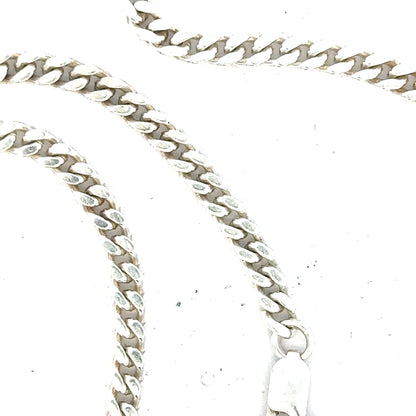 Silver curb chain weighing 24.8g, unbranded jewelry chain with a classic interlinked design, shown in the image.