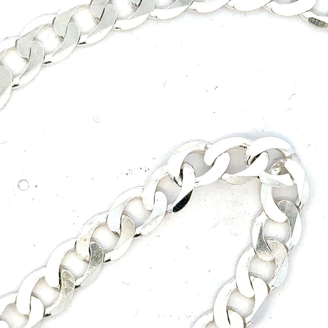 Silver curb chain weighing 34.5g, unbranded jewelry chain with a classic curb link design.
