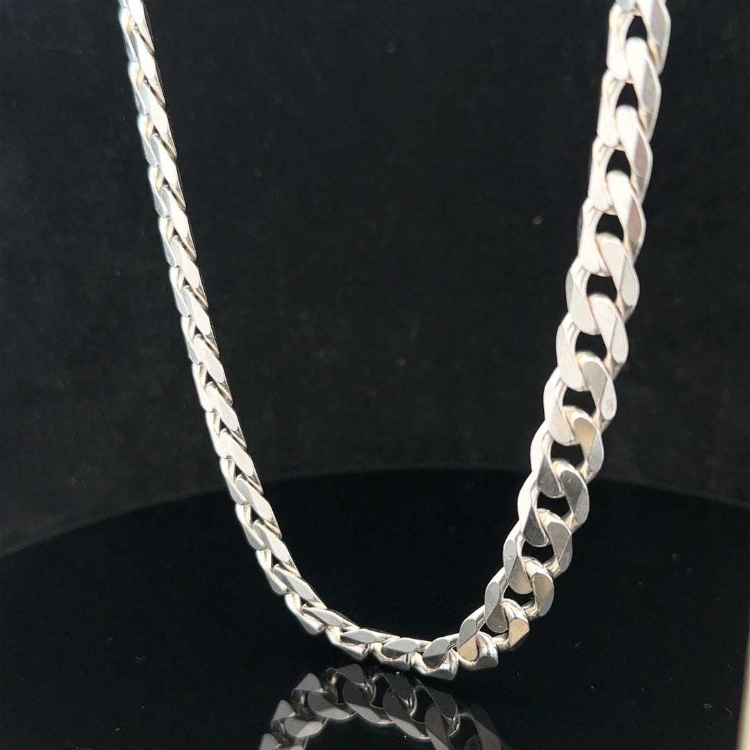 Silver curb chain weighing 60.4g, featuring classic linked design, crafted for durable and stylish jewelry.