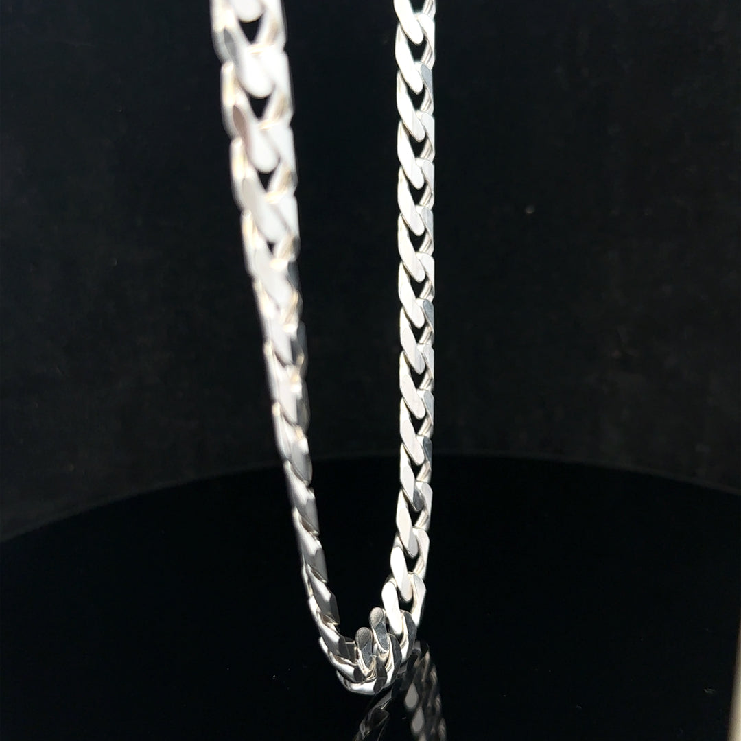 Silver curb chain weighing 60.4g, featuring classic linked design, crafted for jewelry or fashion accessories.