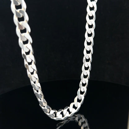 Silver curb chain weighing 60.4g, featuring a classic linked design, ideal for jewelry or accessories.