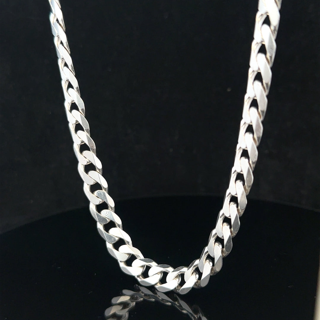 Silver curb chain weighing 60.4g, featuring classic interlinked design, shown on a plain background.