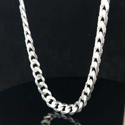 Silver curb chain weighing 60.4g, featuring classic interlinked design, shown on a plain background.