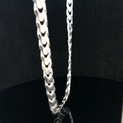 Silver curb chain weighing 60.4g, unbranded jewelry chain with a polished finish and classic curb link design.