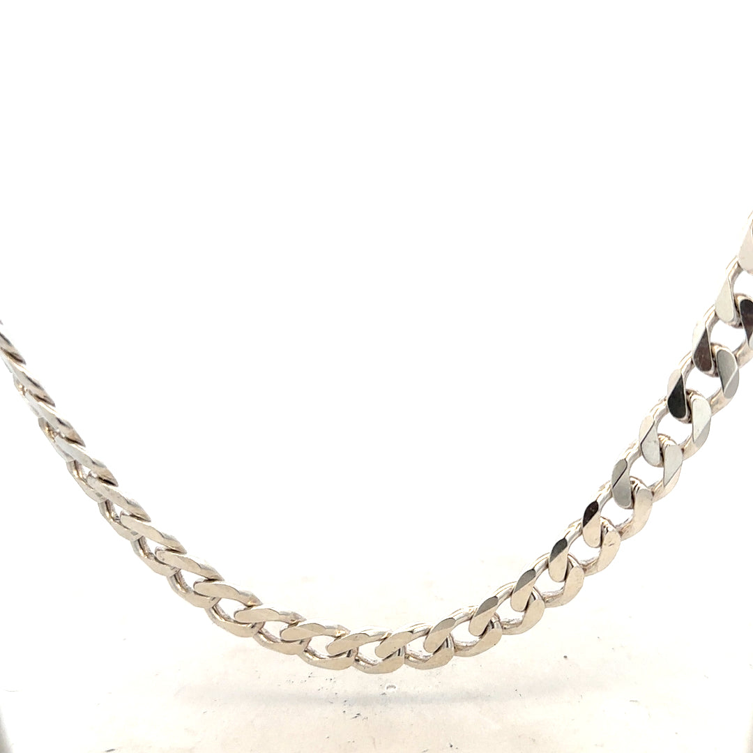 Silver curb chain weighing 66.7g with a classic design, shown in a close-up image highlighting its polished links.