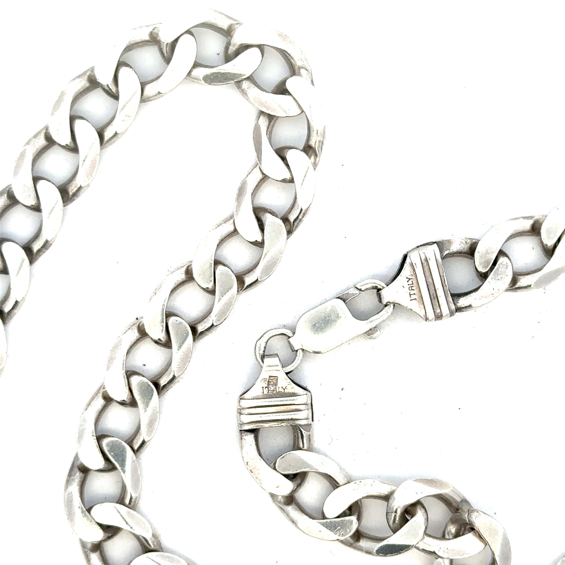 Silver curb chain weighing 80.2g, featuring interlocking links, ideal for jewelry making or accessorizing.