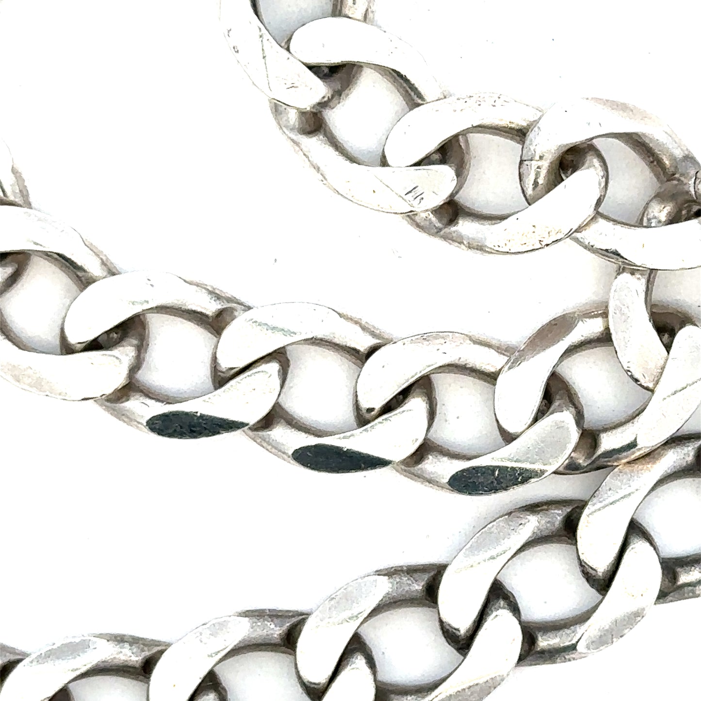 Silver curb chain, unbranded, weighing 80.2g, with a classic linked design, shown on a plain background.