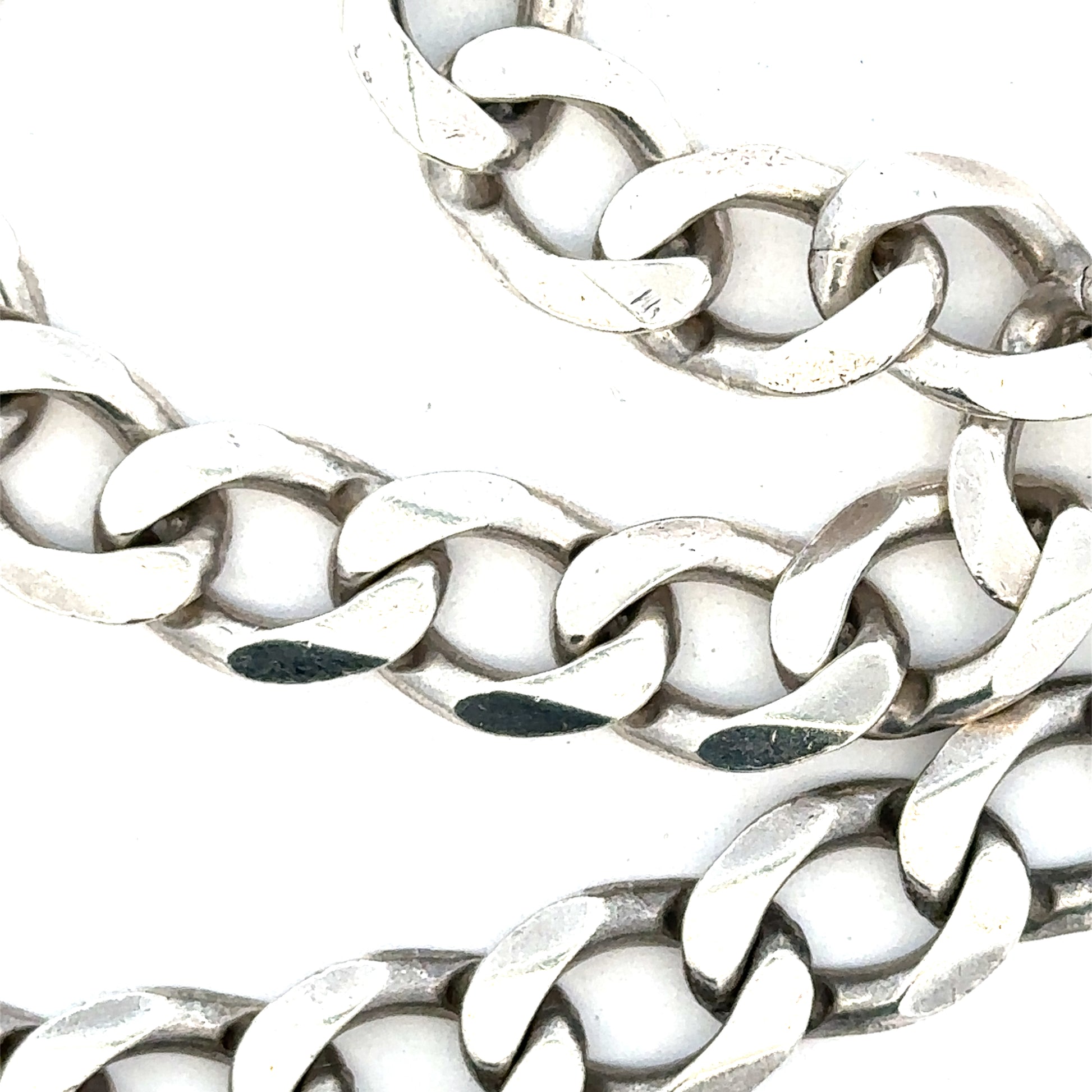 Silver curb chain, unbranded, weighing 80.2g, with a classic linked design, shown on a plain background.