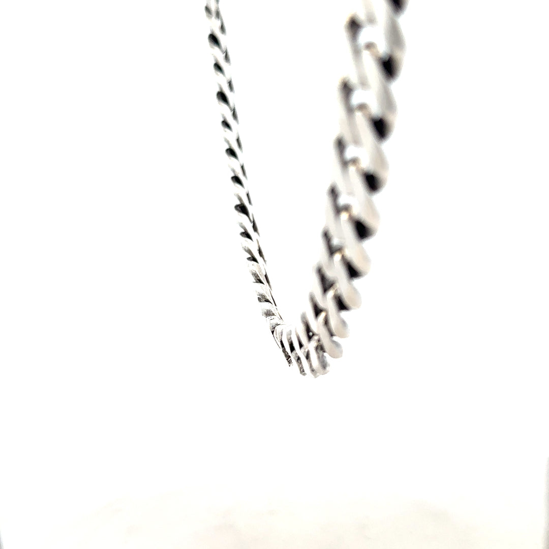 Silver curb chain weighing 91.1g with a classic link design, ideal for jewelry or accessories.
