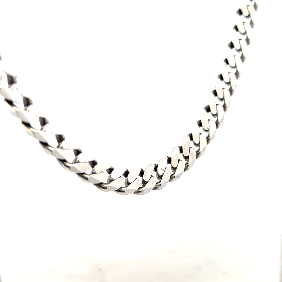 Silver curb chain weighing 91.1g, featuring a sleek unbranded design with interlocked links, shown in close-up.