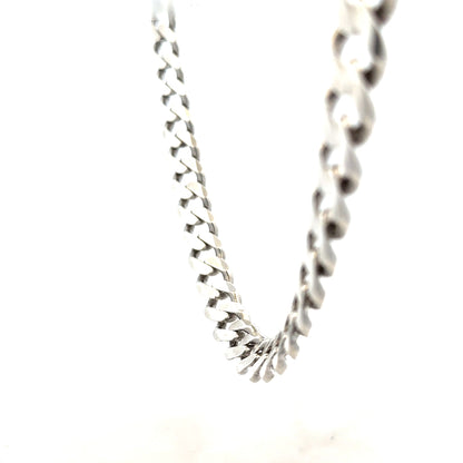 Silver curb chain, unbranded, 94.7g, shown in a close-up image highlighting the sturdy links and polished surface.