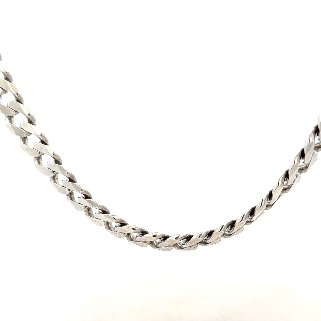 Silver curb chain weighing 94.7g, unbranded jewelry chain with a sleek, classic design, photographed against a neutral background.