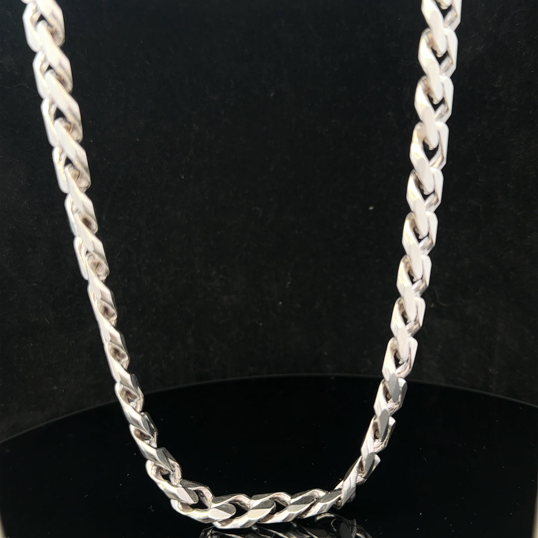 Silver curb chain weighing 95.2g, featuring a classic design with interlocking links, perfect for jewelry or accessory use.