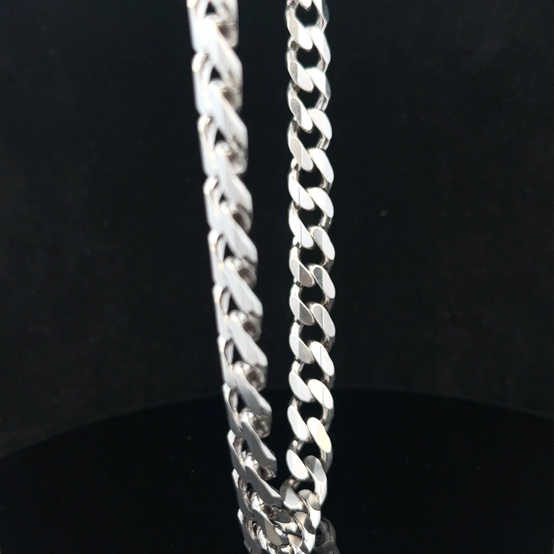 Silver curb chain weighing 95.2g with a classic design, shown in a close-up image highlighting its links and polished finish.