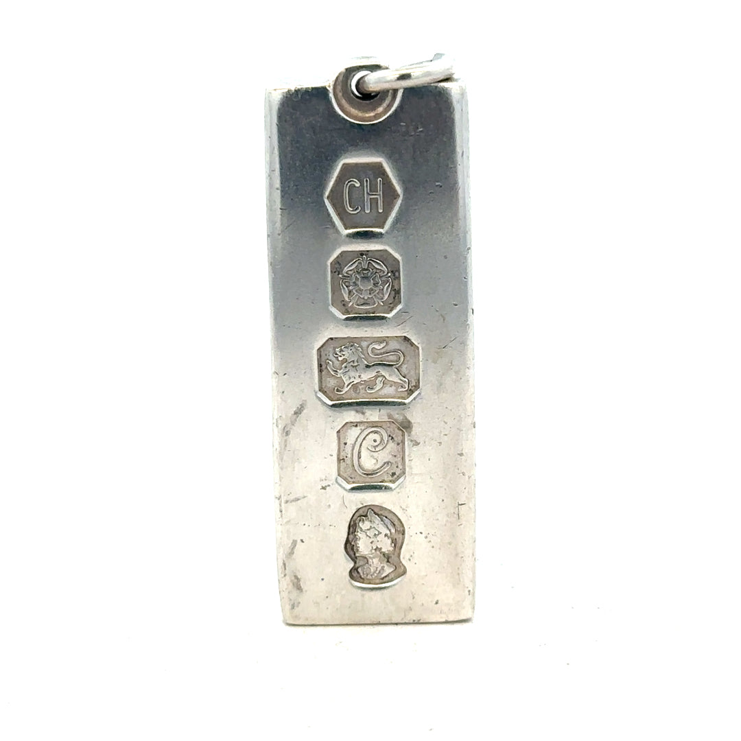 Silver ingot pendant in 31g with a sleek, polished finish, showcasing a simple and elegant jewelry piece.