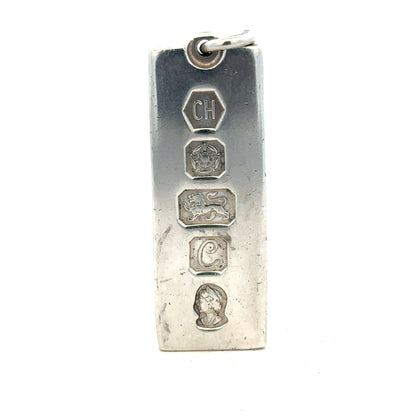 Silver ingot pendant in 31g with a sleek, polished finish, showcasing a simple and elegant jewelry piece.