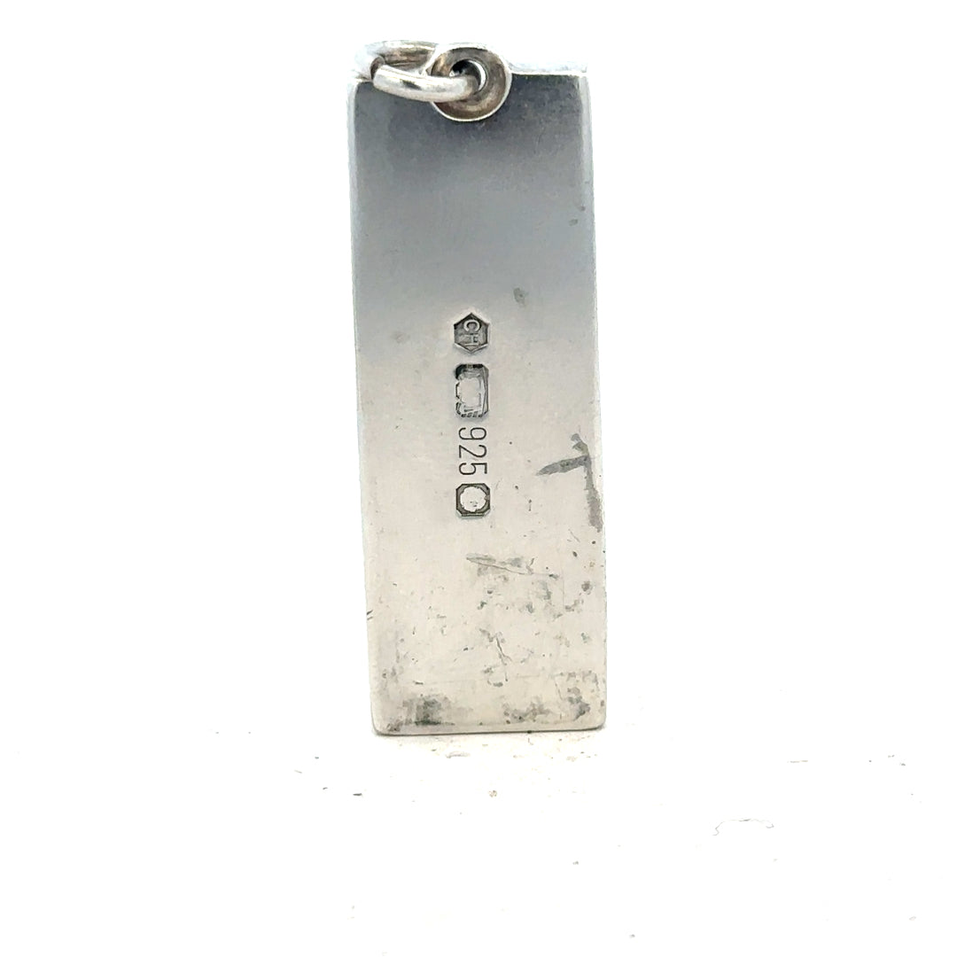 Silver ingot pendant weighing 31g, unbranded, featuring a smooth metallic surface and simple pendant design.
