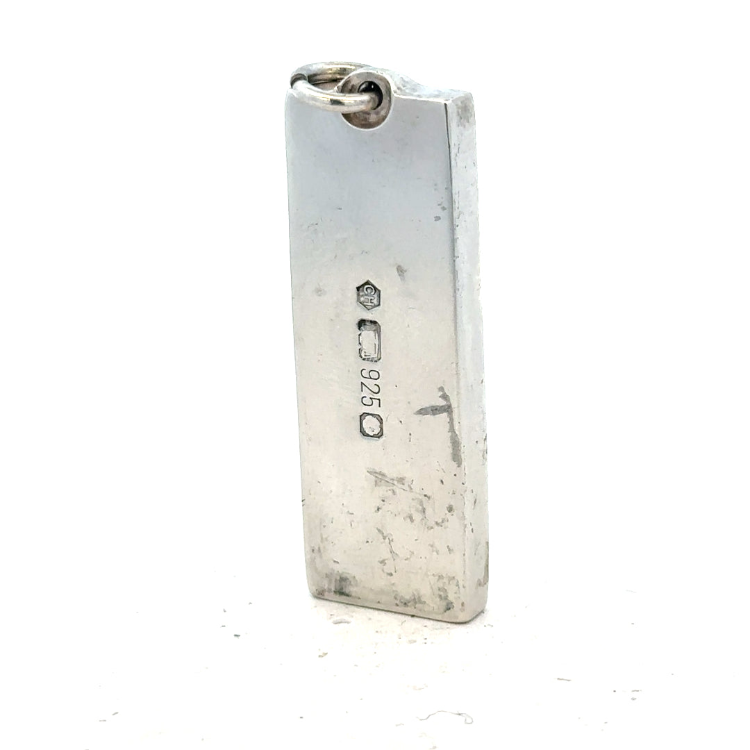 Silver ingot pendant weighing 31g, unbranded jewelry piece with a sleek, polished metal finish and rectangular shape.