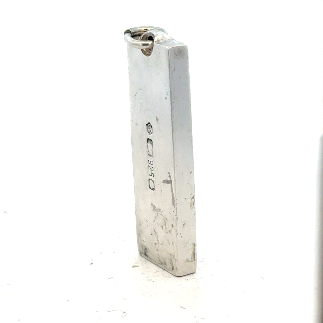 Silver ingot pendant, 31g, unbranded, with a smooth polished surface and rectangular shape, displayed against a neutral background.