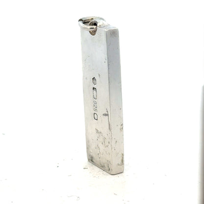 Silver ingot pendant, 31g, unbranded, with a smooth polished surface and rectangular shape, displayed against a neutral background.
