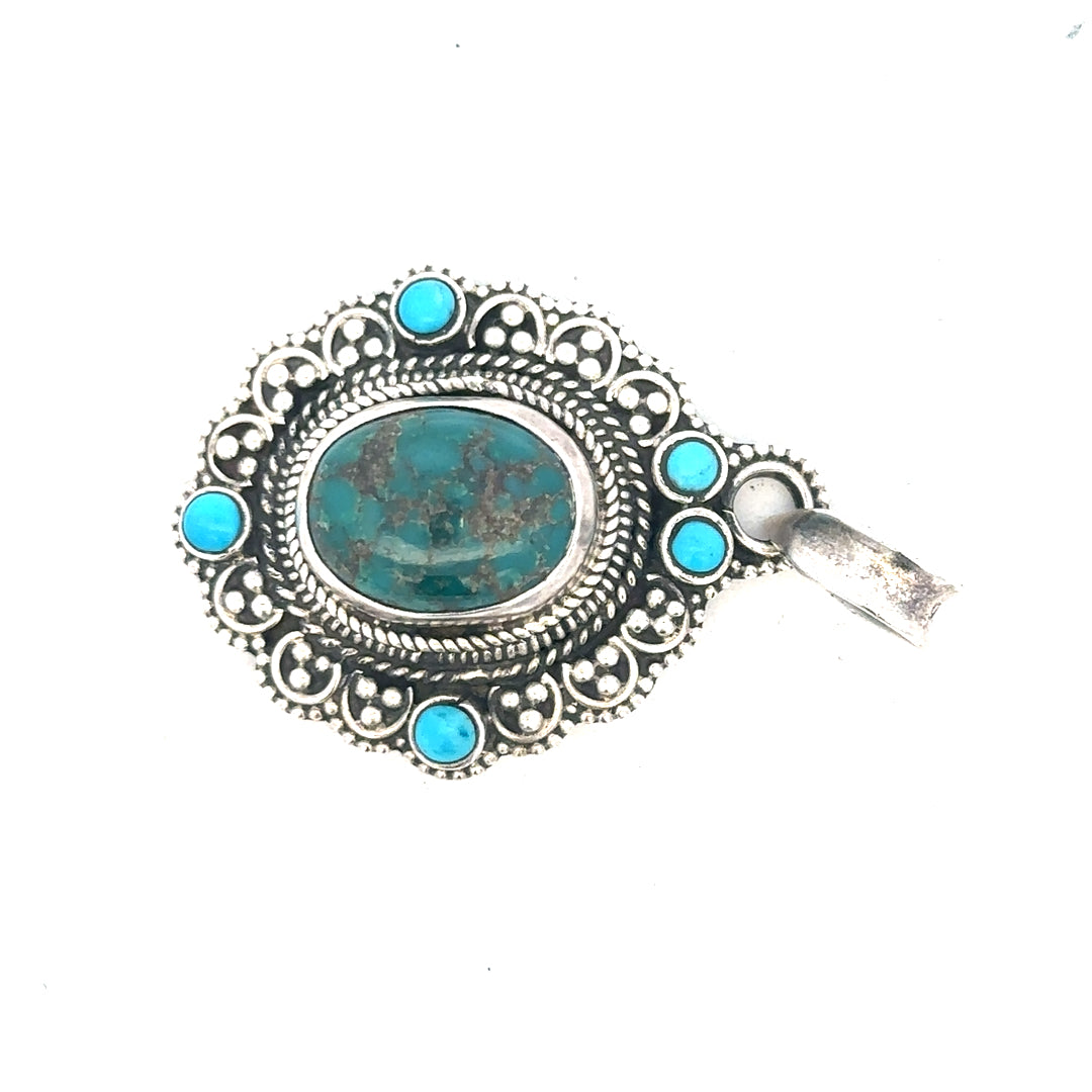 Silver pendant weighing 15.9g, featuring a sleek unbranded design, shown with detailed craftsmanship and polished finish.
