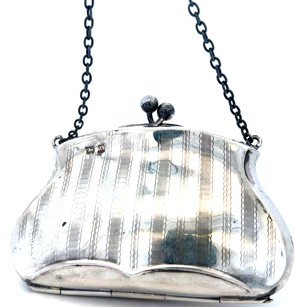 Silver purse pendant weighing 66.2g, unbranded jewelry accessory with detailed design, suitable for necklaces or charms.