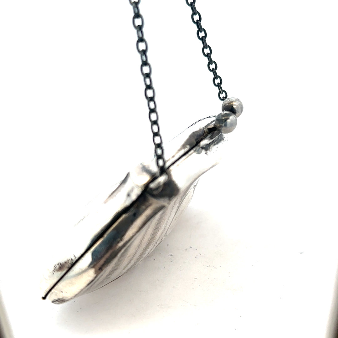 Silver pendant shaped like a purse weighing 66.2g, unbranded jewelry accessory with detailed design on a neutral background.