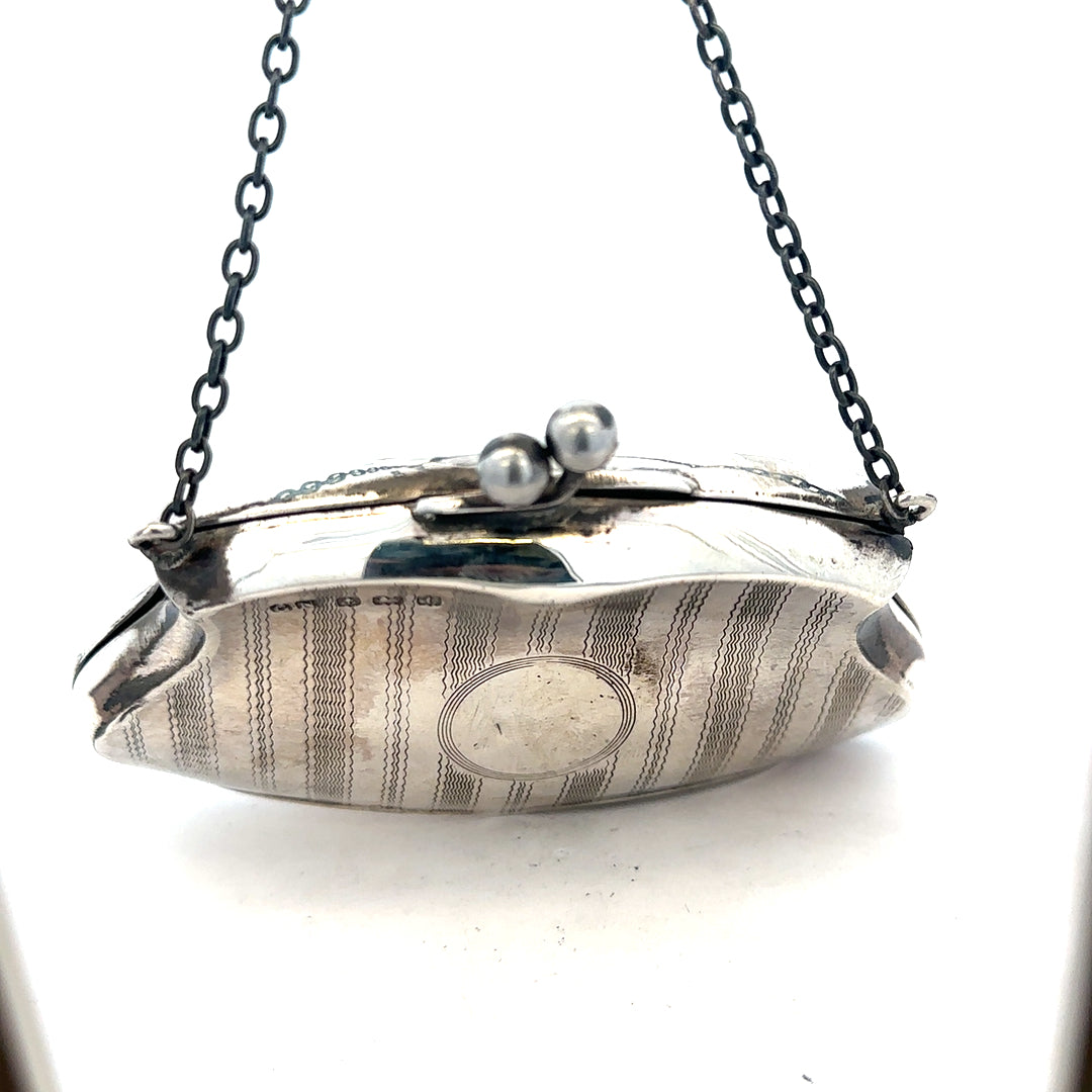 Silver purse pendant weighing 66.2g, unbranded jewelry accessory with detailed design, shown close-up image.