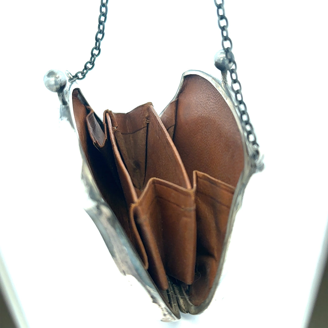 Silver purse pendant weighing 66.2g, unbranded, with detailed design visible in the image.