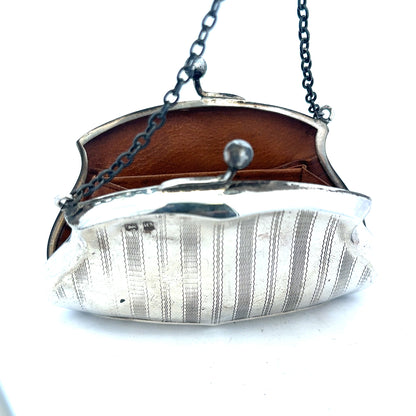Silver purse pendant weighing 66.2g, unbranded, featuring detailed craftsmanship and a shiny metallic finish.