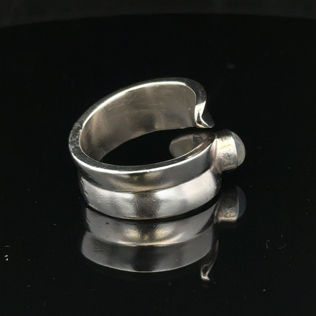 Silver ring size R with a sleek band, unbranded, shown on a plain background in this product image.