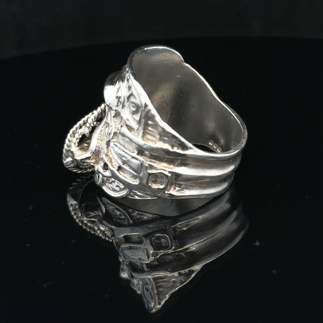 Silver saddle ring in size V, unbranded, featuring a smooth, polished design ideal for stylish jewelry accessories.