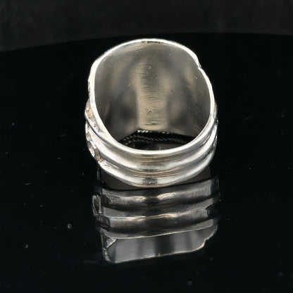 Silver saddle ring in size V with a polished finish, featuring a classic design, unbranded jewelry accessory for stylish wear.