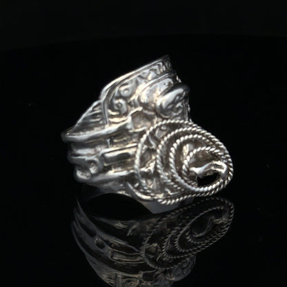 Silver saddle ring in size V with a smooth, polished finish, designed for stylish wear and comfortable fit.