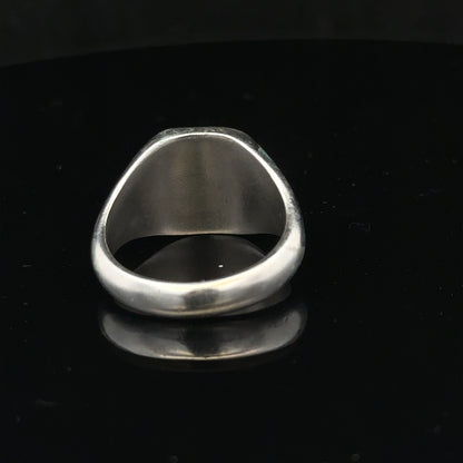 Silver signet ring in size V with a smooth, polished surface, unbranded, featuring a classic design suitable for everyday wear.