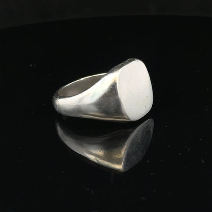 Silver signet ring in size V with a smooth finish, unbranded, featuring a classic design perfect for everyday wear.