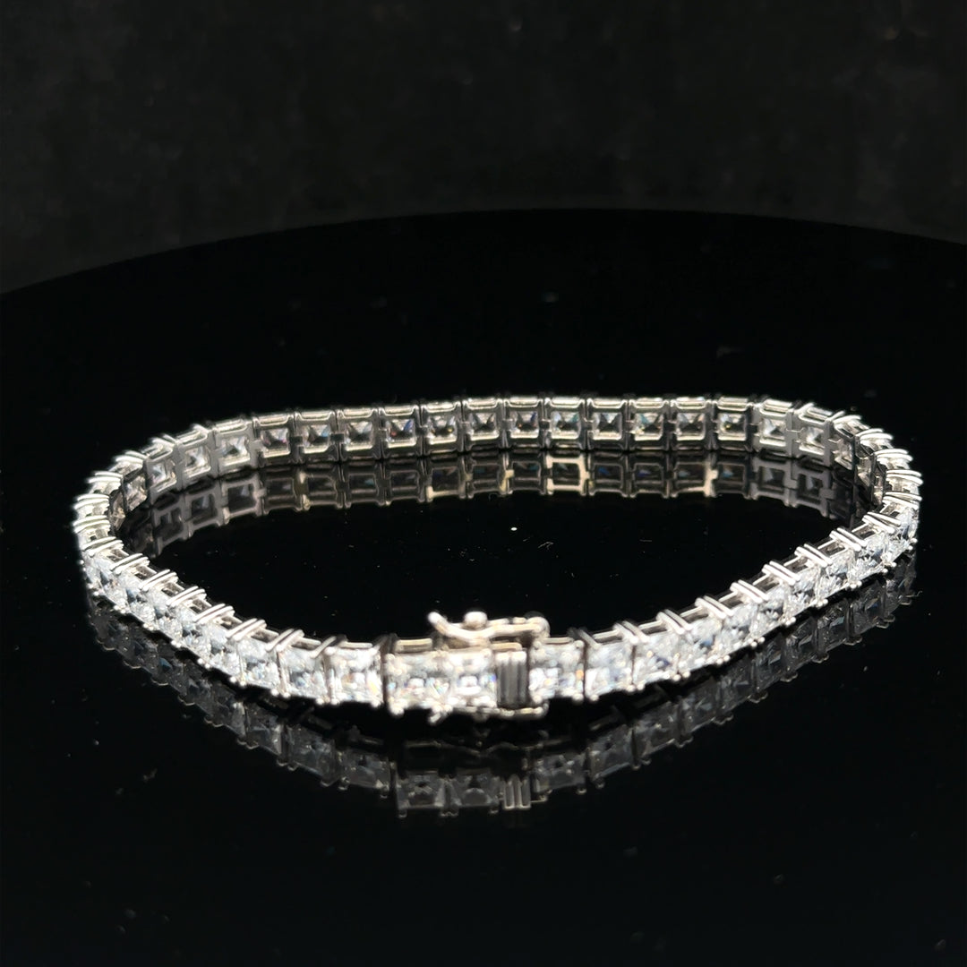 Silver tennis bracelet weighing 15.6g with a sleek design, featuring linked silver segments for a stylish and elegant look.