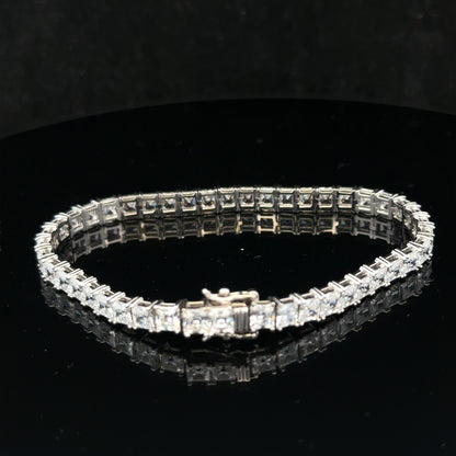 Silver tennis bracelet weighing 15.6g with a sleek design, featuring linked silver segments for a stylish and elegant look.