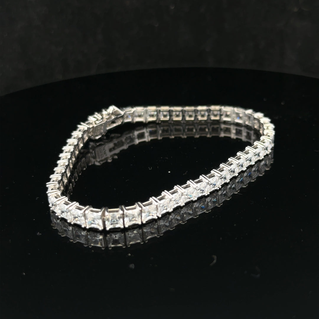 Silver tennis bracelet weighing 15.6g with a sleek, elegant design, featuring interconnected links for a sophisticated look.
