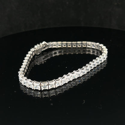 Silver tennis bracelet weighing 15.6g with a sleek, elegant design, featuring interconnected links for a sophisticated look.
