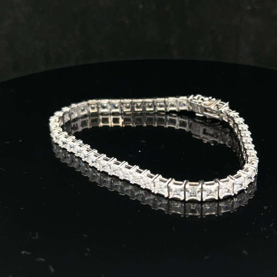 Silver tennis bracelet weighing 15.6g with a sleek, elegant design, featuring a continuous row of sparkling silver links.