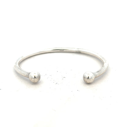 Silver torque bracelet with 20g weight, unbranded design, featuring a sleek, polished finish suitable for everyday wear.